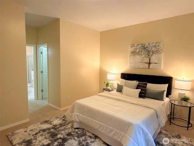 a bathroom with a sink double vanity and a mirror