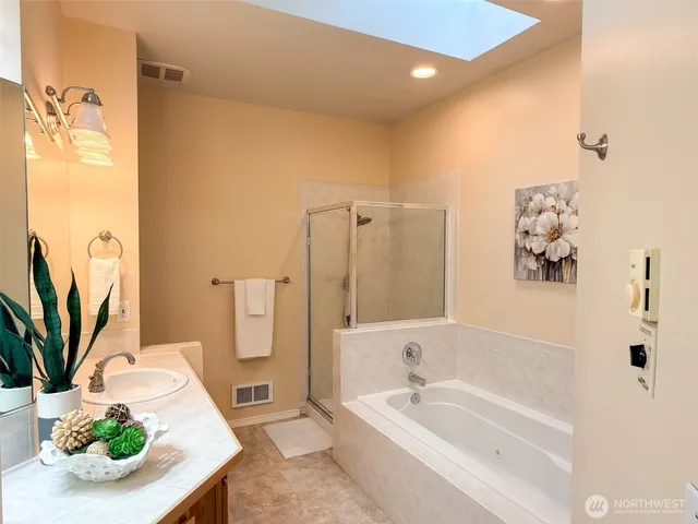 a bedroom with a bed and a lamp