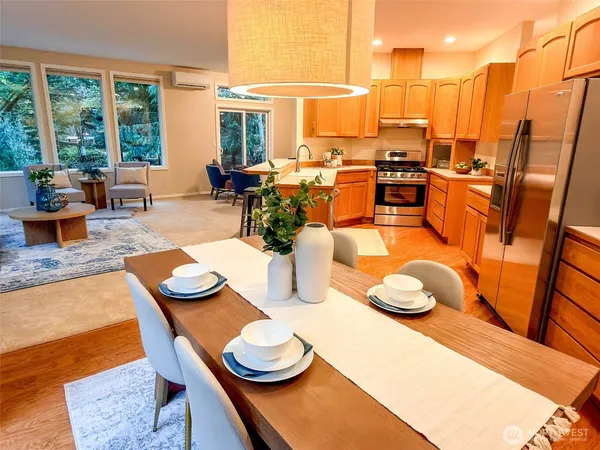 a dining room with a table and chairs