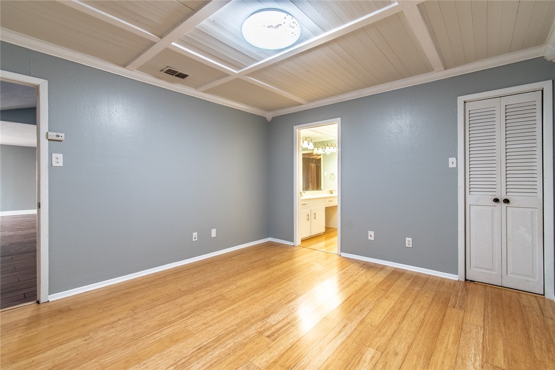 930 Waterview Street Portland, TX 78374 - Photo 26 of 38 a view of an empty room with wooden floor and a window