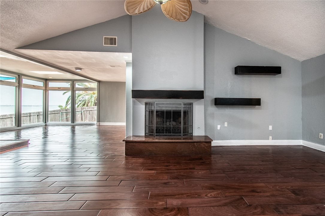 930 Waterview Street Portland, TX 78374 - Photo 31 of 38 a view of empty room with wooden floor and fireplace