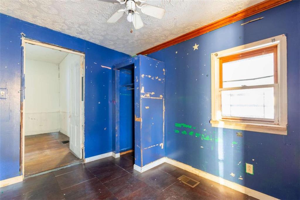 1829 Williams Avenue East Point, GA 30344 - Photo 14 of 21 a view of empty room with window and wooden floor