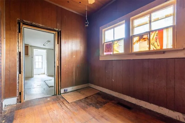 a view of an empty room and bathroom