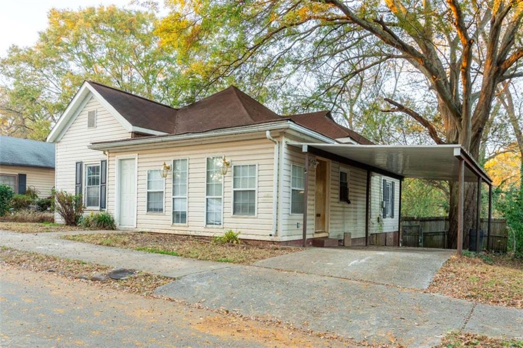 1829 Williams Avenue East Point, GA 30344 - Photo 2 of 21 a front view of a house with a garden