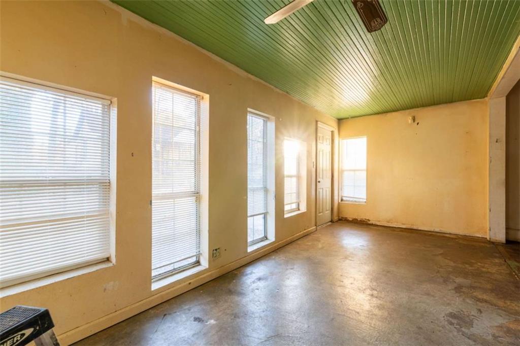 1829 Williams Avenue East Point, GA 30344 - Photo 3 of 21 a view of an empty room with wooden floor and a window