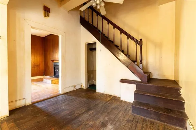 a view of entryway and hall with wooden floor