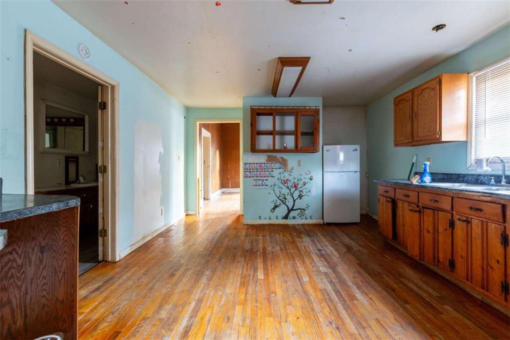 1829 Williams Avenue East Point, GA 30344 - Photo 10 of 21 a view of a kitchen with furniture and wooden floor