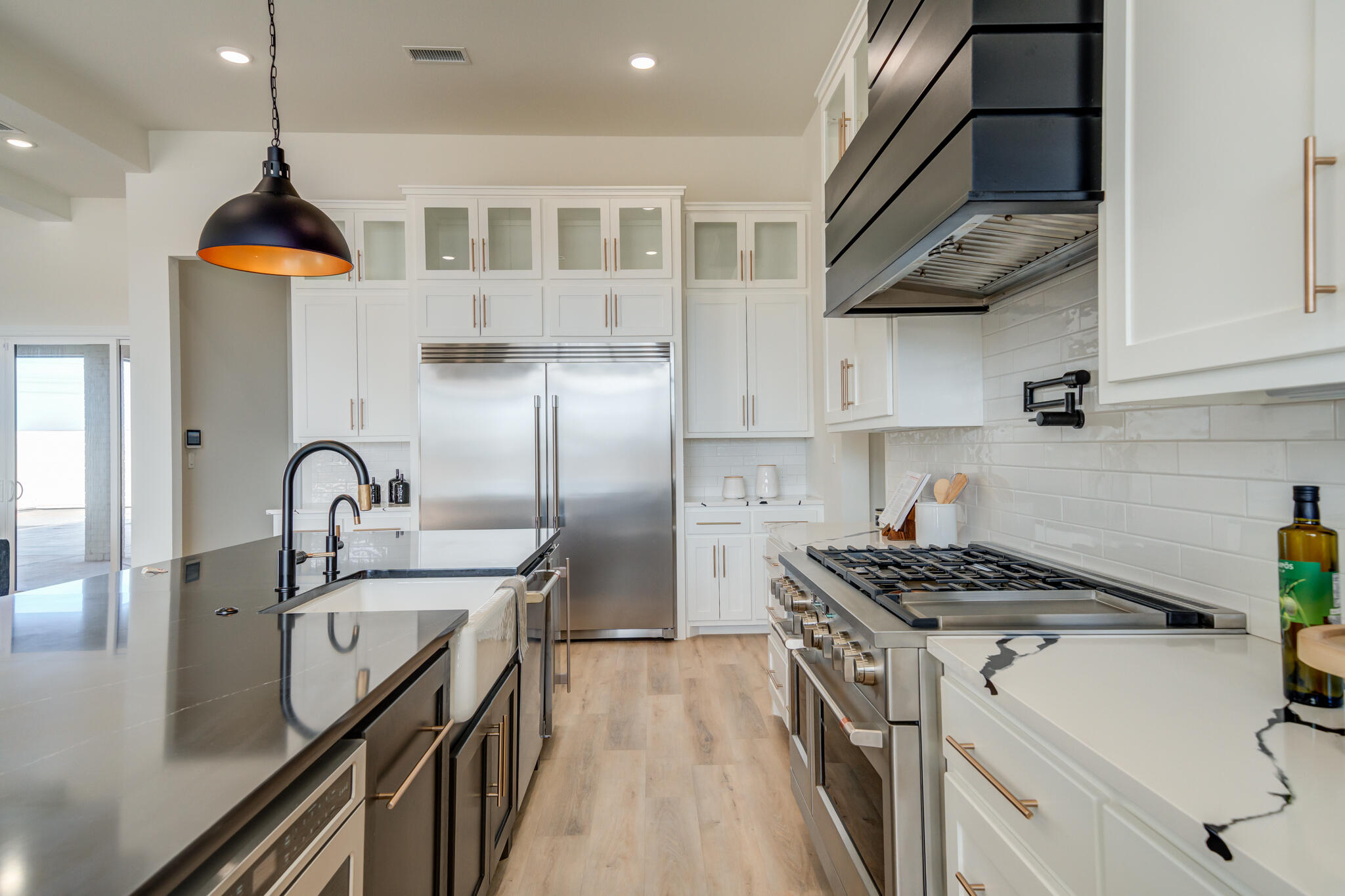 3902 148th Street Lubbock, TX 79423 - Photo 12 of 83 a kitchen with stainless steel appliances granite countertop a sink a stove and a refrigerator
