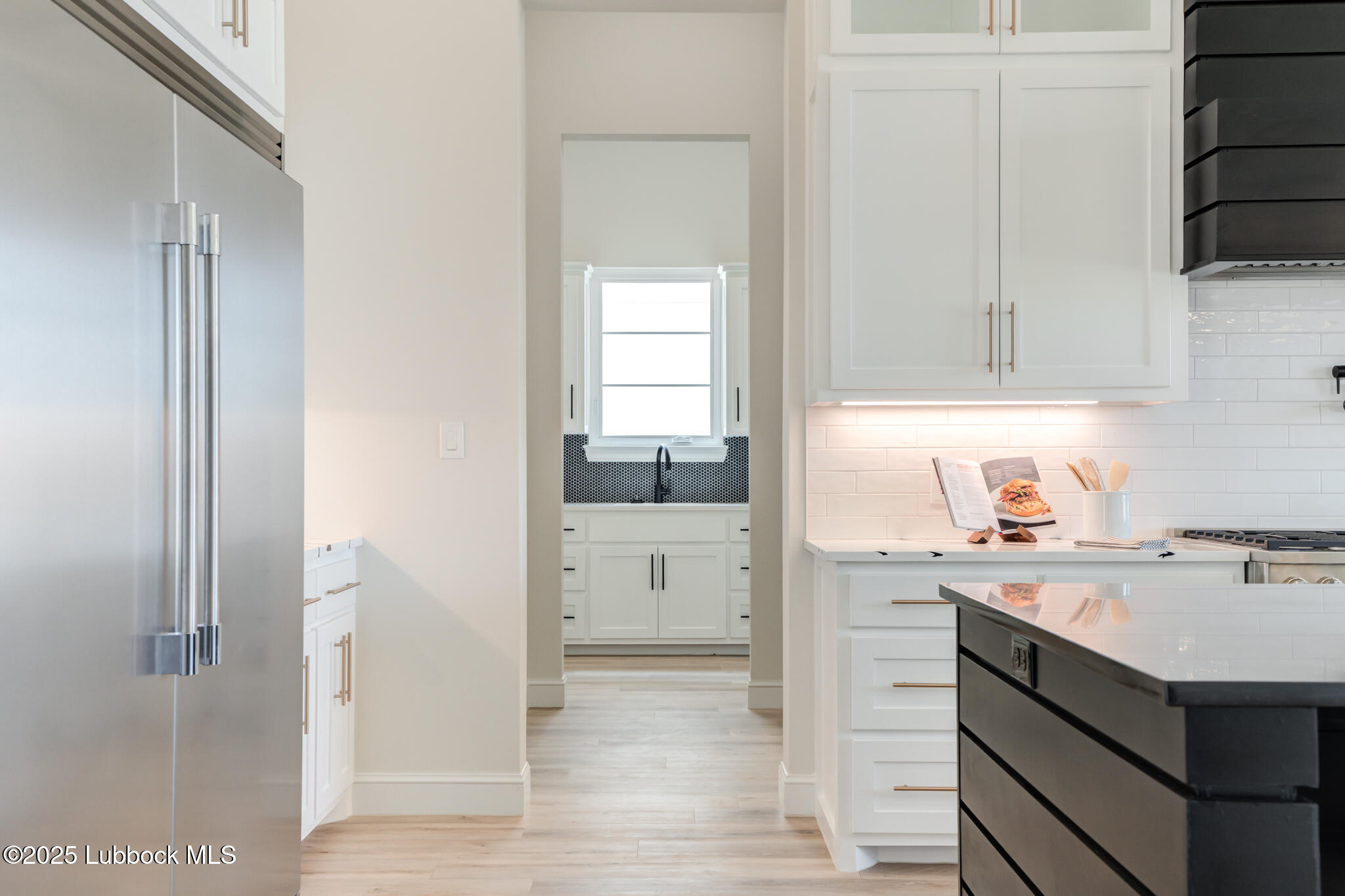 3902 148th Street Lubbock, TX 79423 - Photo 18 of 83 a kitchen with a sink cabinets and window