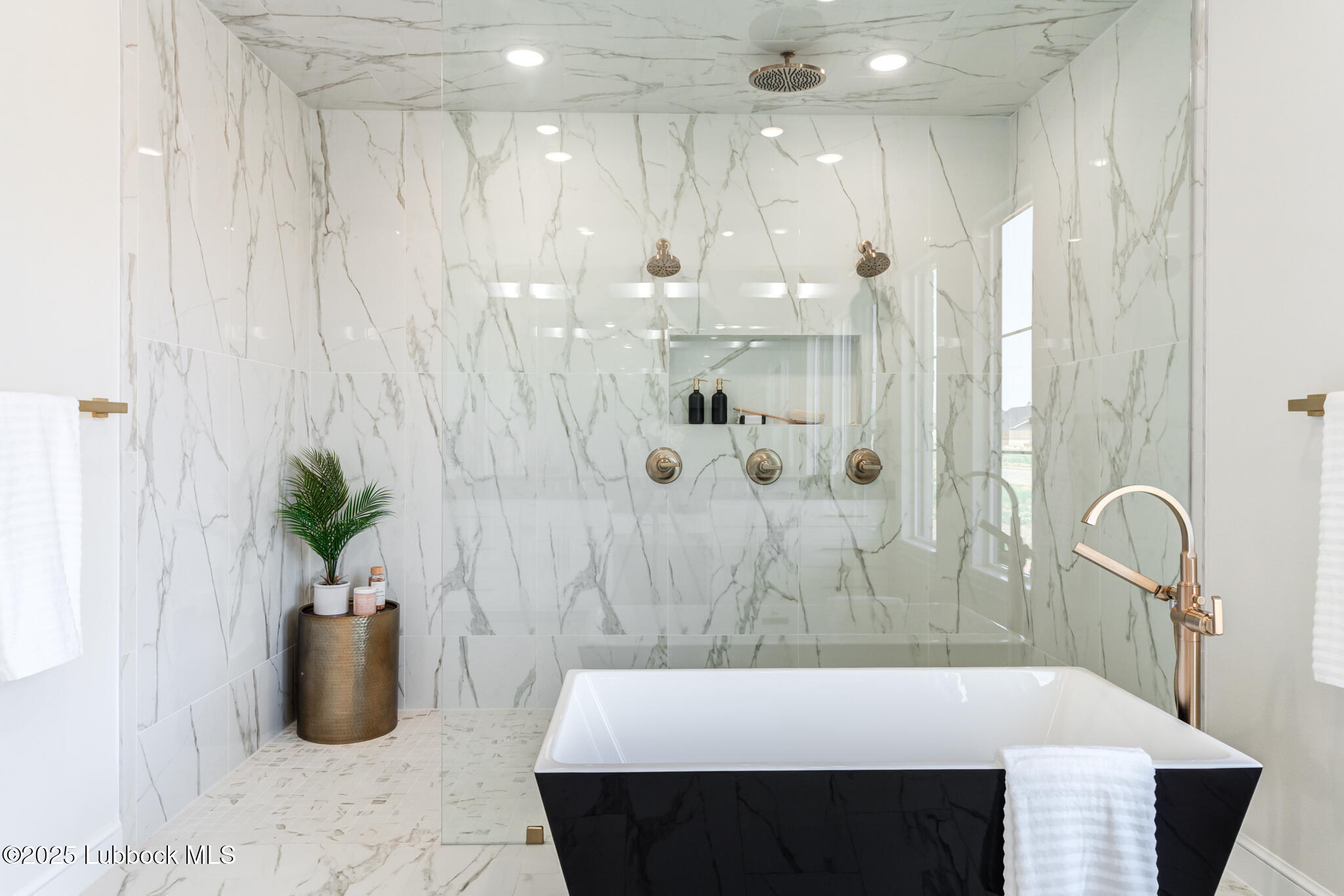 3902 148th Street Lubbock, TX 79423 - Photo 38 of 83 a bathroom with a sink tub and shower