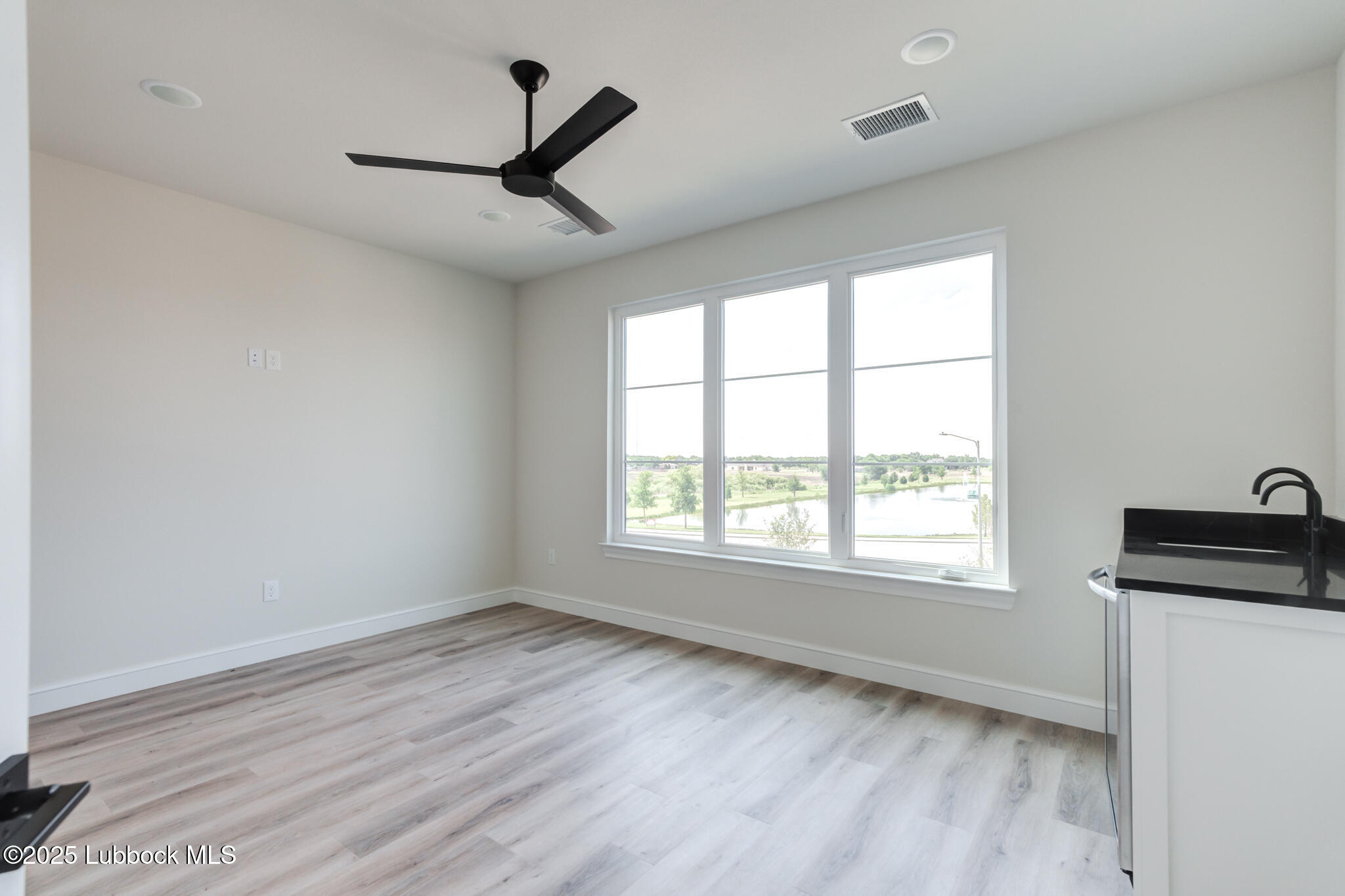 3902 148th Street Lubbock, TX 79423 - Photo 44 of 83 a view of an empty room with a window