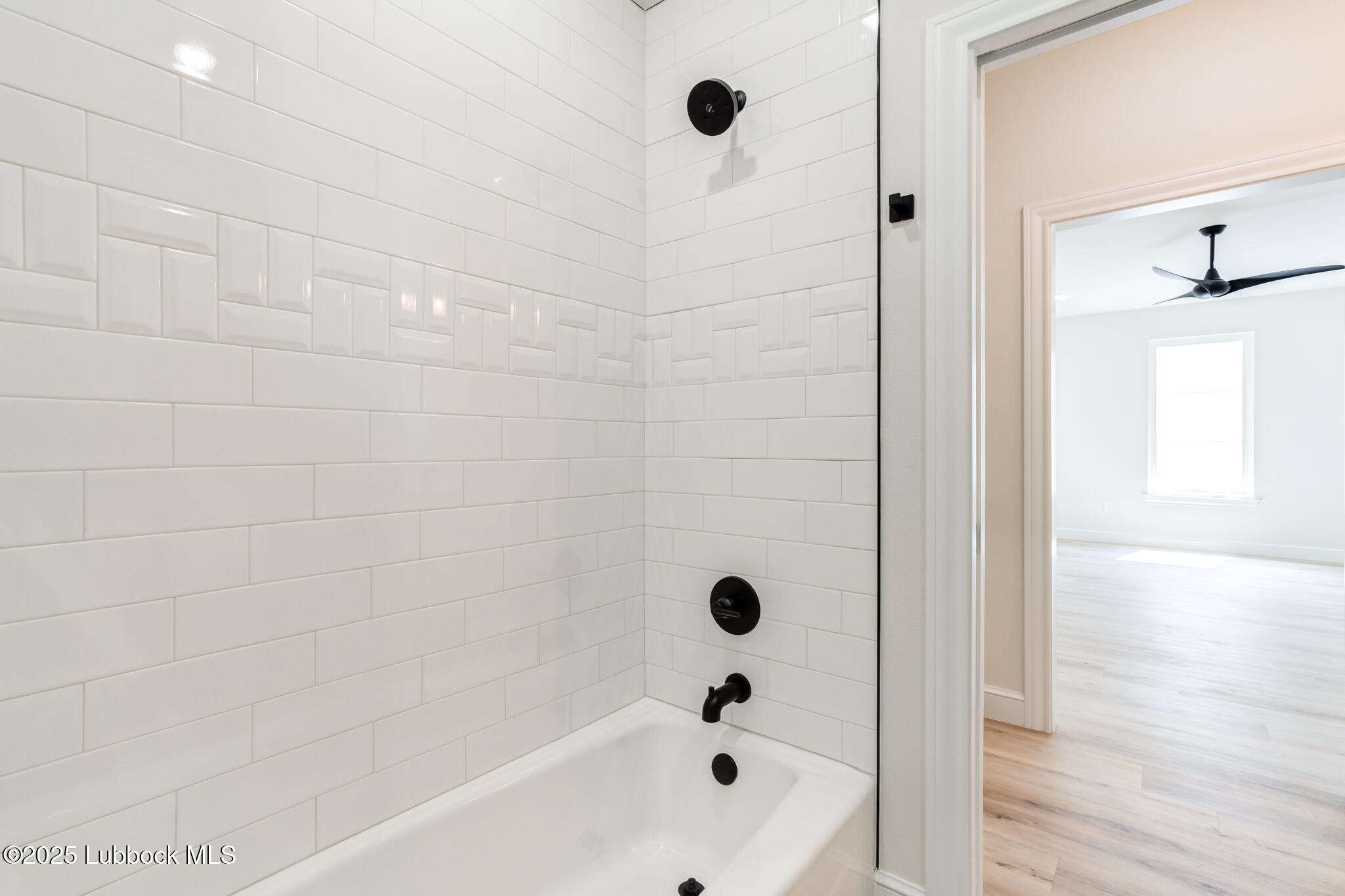 3902 148th Street Lubbock, TX 79423 - Photo 50 of 83 a bathroom with a bathtub and shower