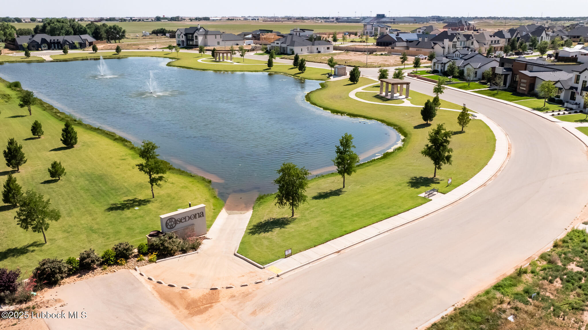 3902 148th Street Lubbock, TX 79423 - Photo 80 of 83 an aerial view of a swimming pool with outdoor seating and yard