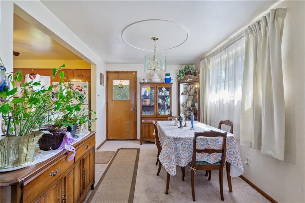 104 Palace Avenue McKees Rocks, PA 15136 - Photo 7 of 25 Spacious dining room with door to covered back porch.