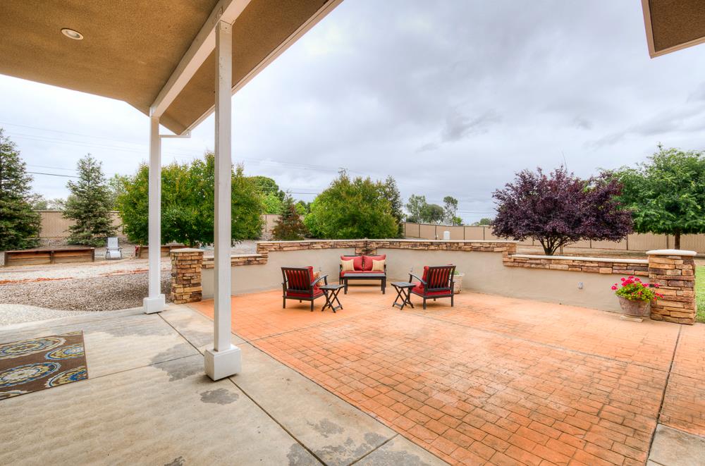17465 Monreal Road Madera, CA 93636 - Photo 12 of 59 a view of a terrace with chairs and a patio