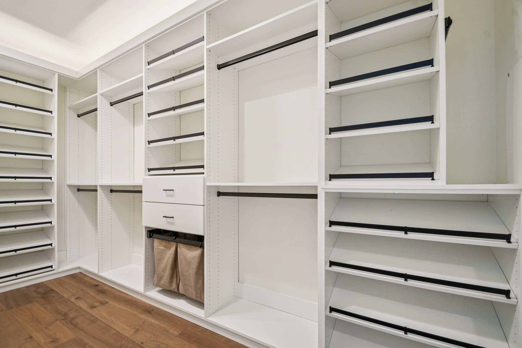 2518 Watkins Way Austin, TX 78746 - Photo 14 of 28 a view of walk in closet with empty racks