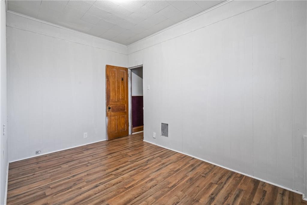 200 Moye Place Pittsburgh, PA 15210 - Photo 16 of 36 a view of an empty room with wooden floor