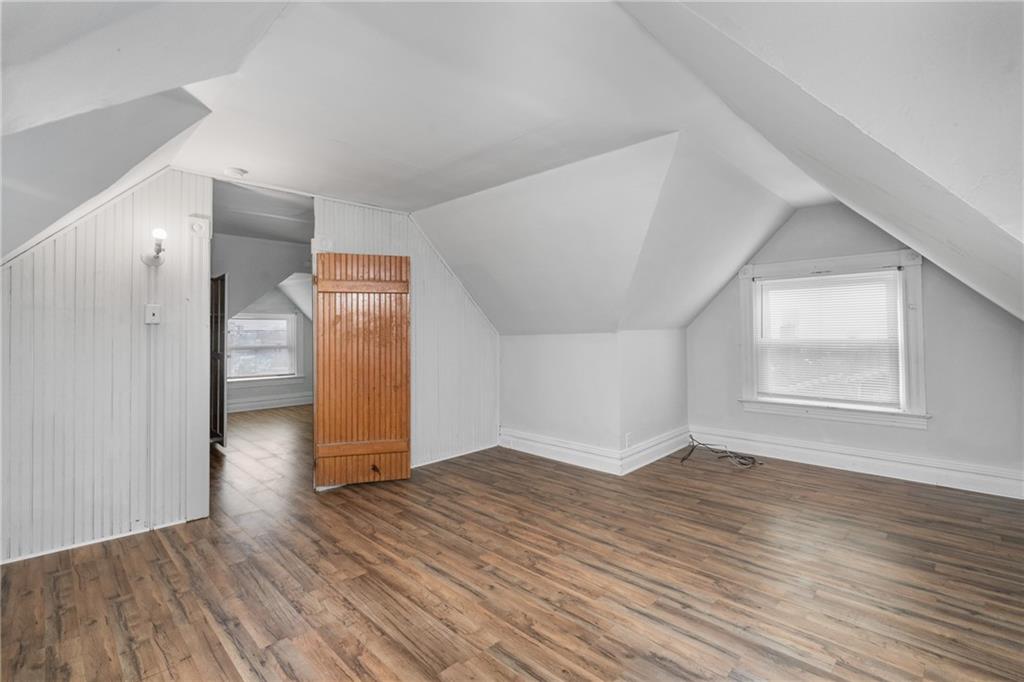 200 Moye Place Pittsburgh, PA 15210 - Photo 23 of 36 an empty room with wooden floor and windows