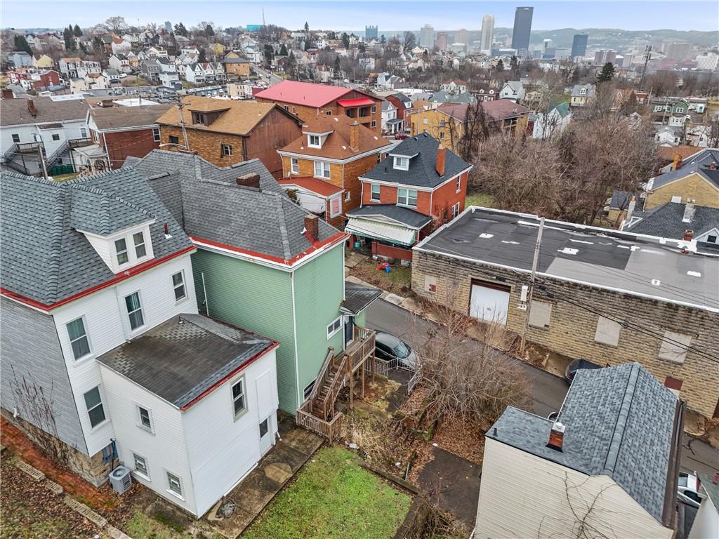 200 Moye Place Pittsburgh, PA 15210 - Photo 31 of 36 an aerial view of a house with a yard garage and city view