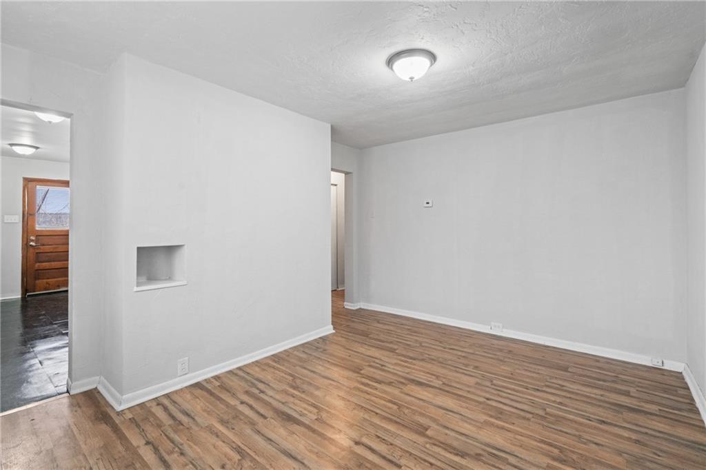 200 Moye Place Pittsburgh, PA 15210 - Photo 8 of 36 a view of an empty room with wooden floor