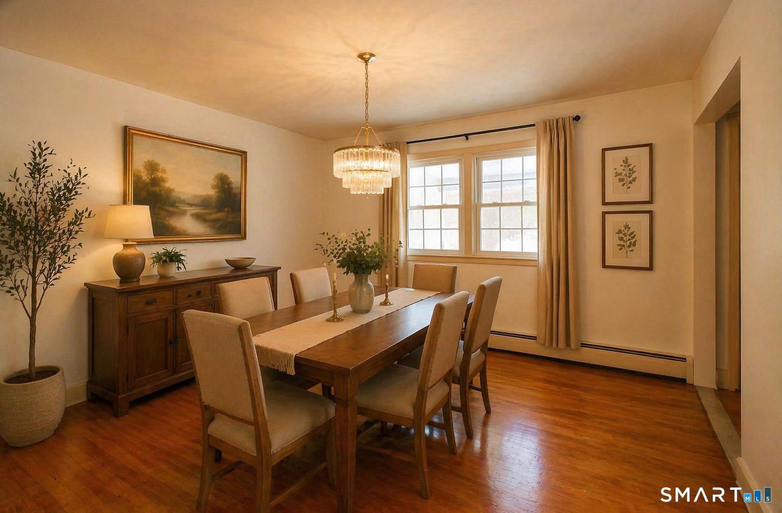 463 Herbert Street Orange, CT 06477 - Photo 12 of 51 a view of a a dining room with furniture window and wooden floor