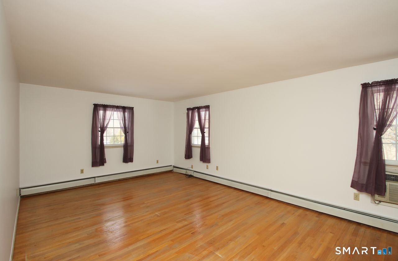 463 Herbert Street Orange, CT 06477 - Photo 19 of 40 an empty room with window
