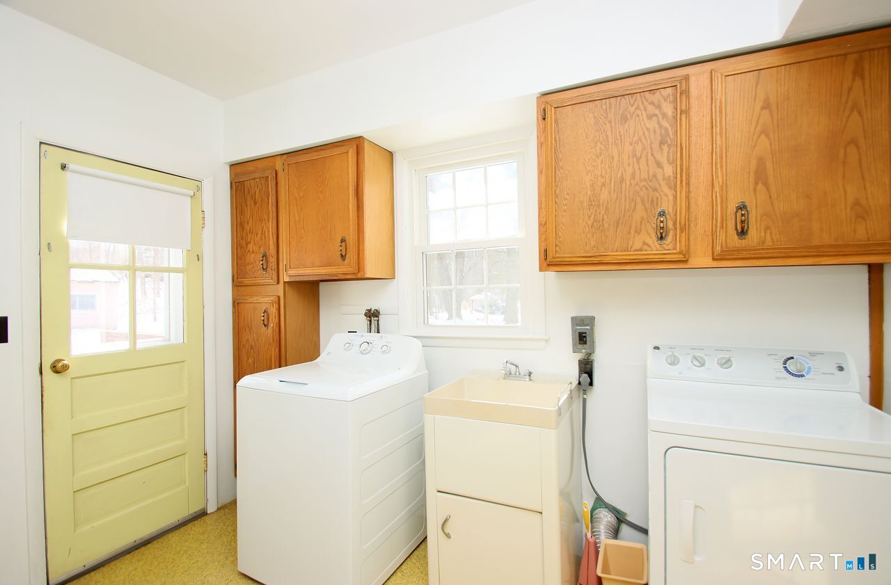463 Herbert Street Orange, CT 06477 - Photo 25 of 51 a utility room with dryer and washer