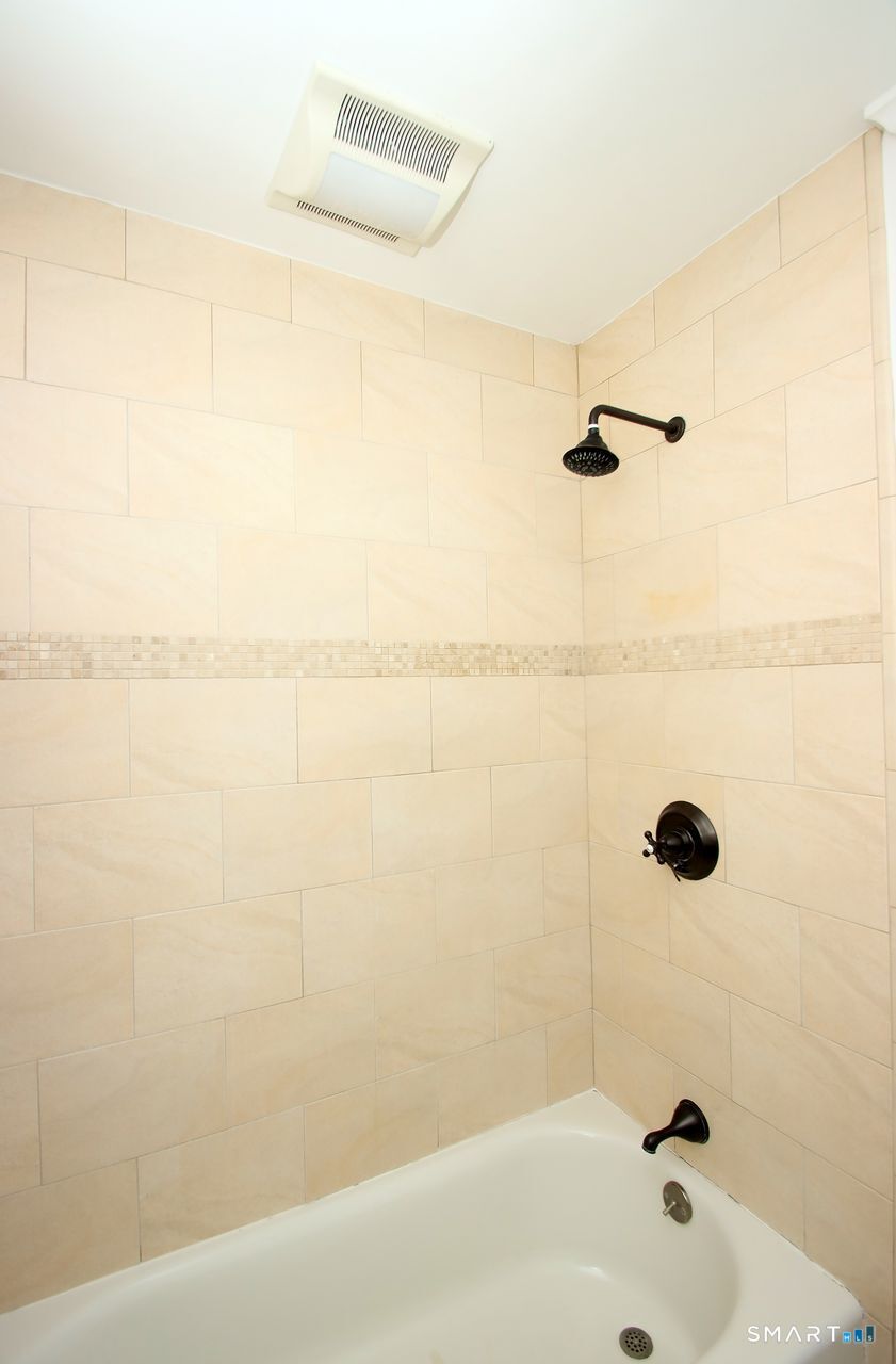 463 Herbert Street Orange, CT 06477 - Photo 29 of 40 a bathroom with a shower