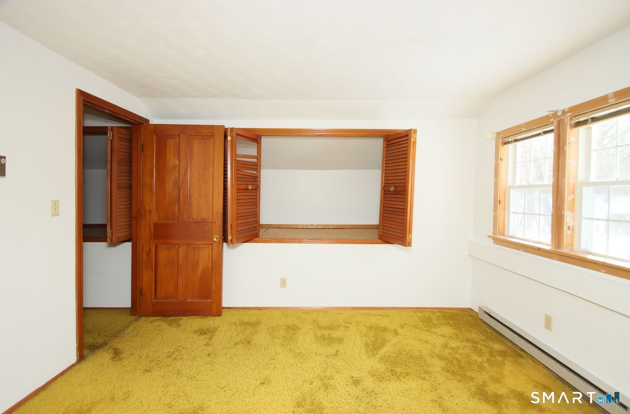 463 Herbert Street Orange, CT 06477 - Photo 35 of 40 a view of an empty room with a window