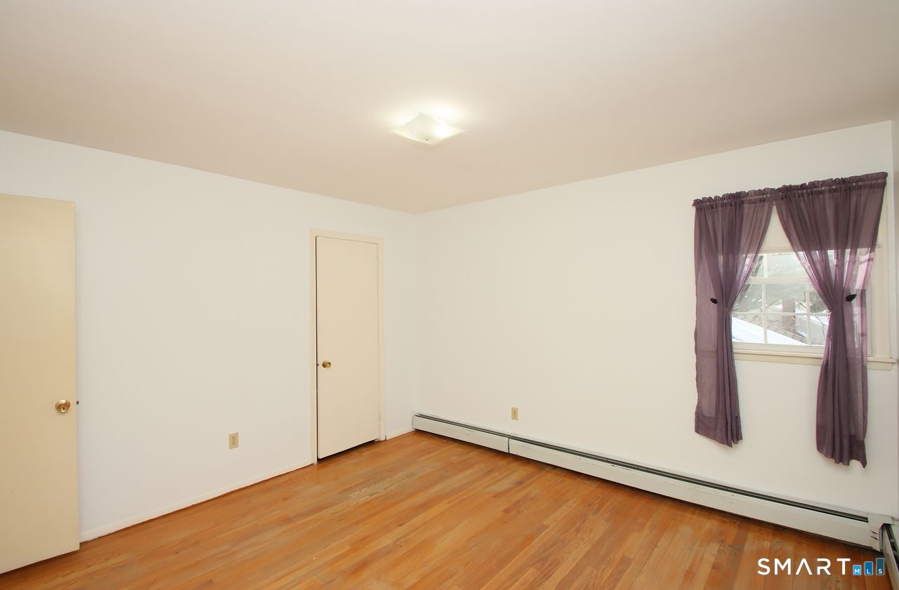463 Herbert Street Orange, CT 06477 - Photo 36 of 51 an empty room with windows