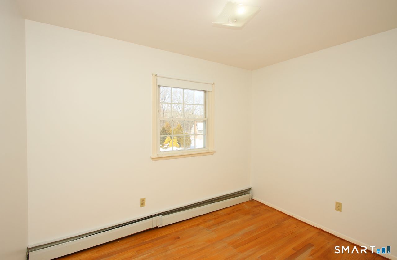 463 Herbert Street Orange, CT 06477 - Photo 38 of 51 an empty room with a window