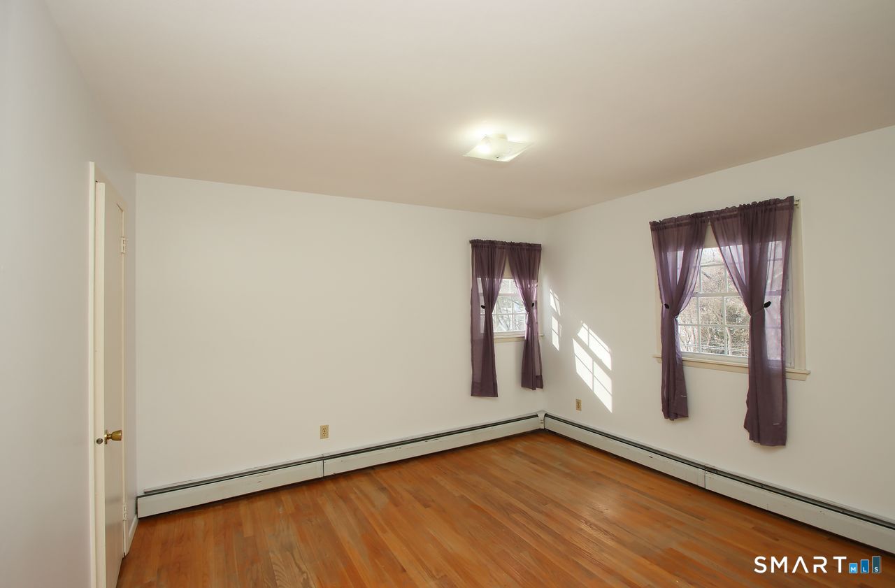 463 Herbert Street Orange, CT 06477 - Photo 44 of 51 an empty room with window