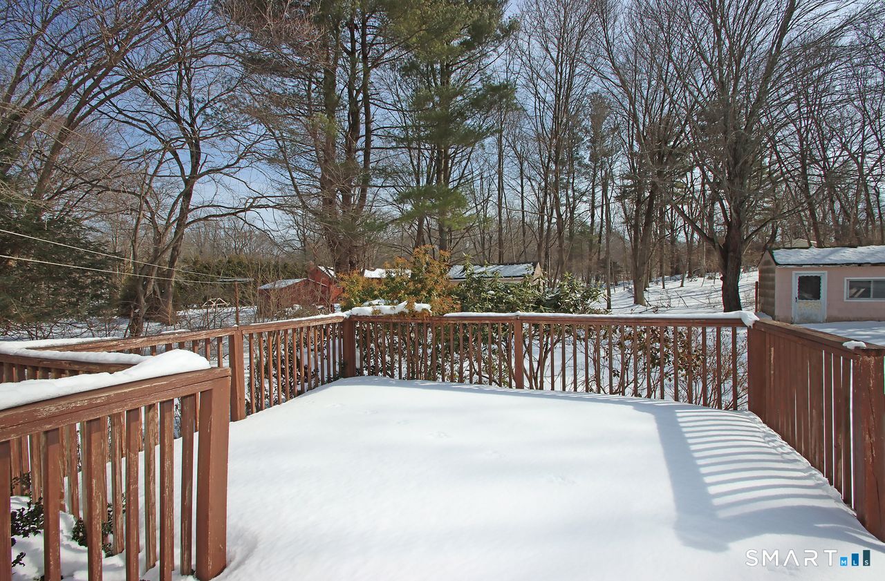 463 Herbert Street Orange, CT 06477 - Photo 6 of 40 a view of street with wooden fence