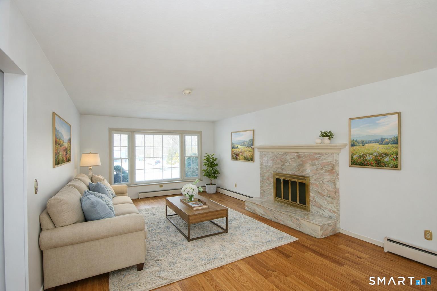 463 Herbert Street Orange, CT 06477 - Photo 8 of 51 a living room with furniture and a fireplace