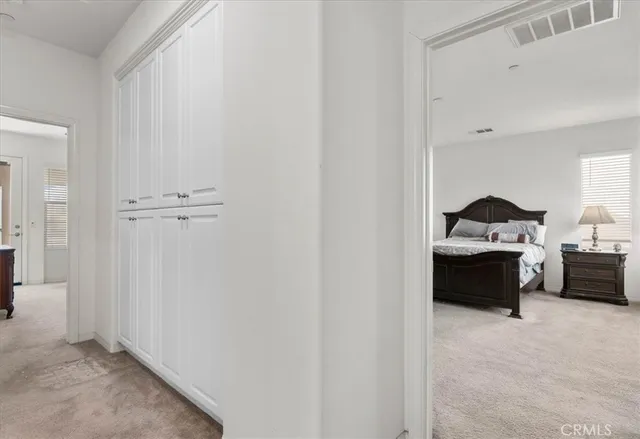 a living room with furniture and a lamp