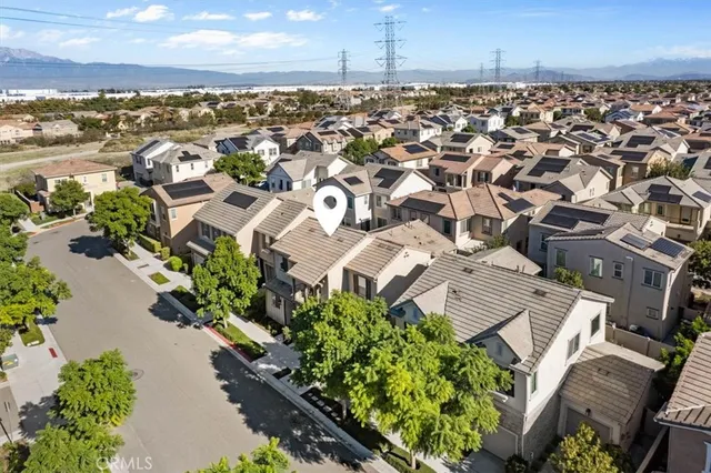 an aerial view of a residential apartment building with a yard