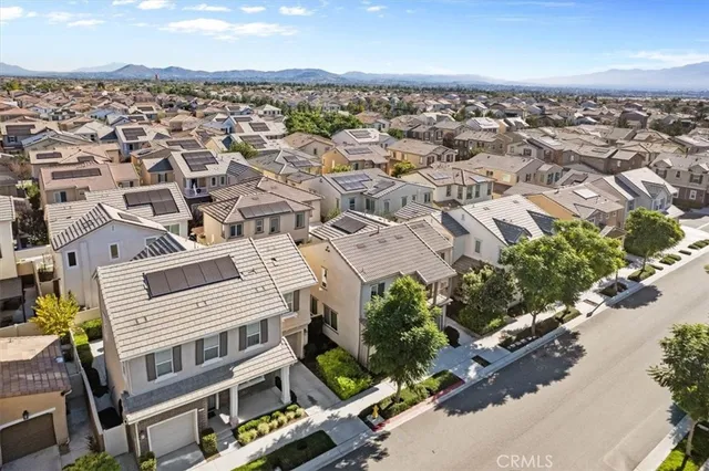an aerial view of a residential apartment building with a yard