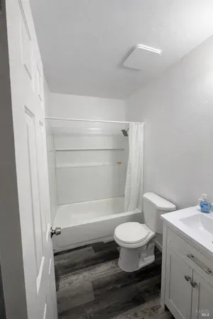 a utility room with sink dryer and washer