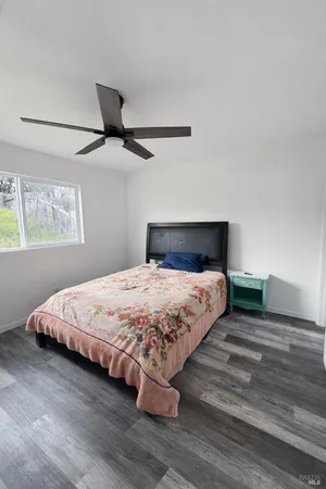 a bedroom with a bed and window