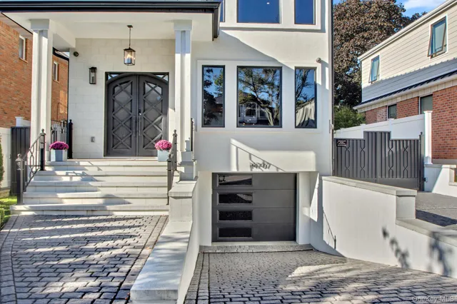 a bedroom with a large bed and a potted plant
