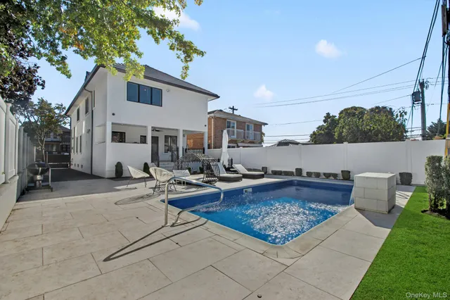 a bedroom with bed and wooden floor