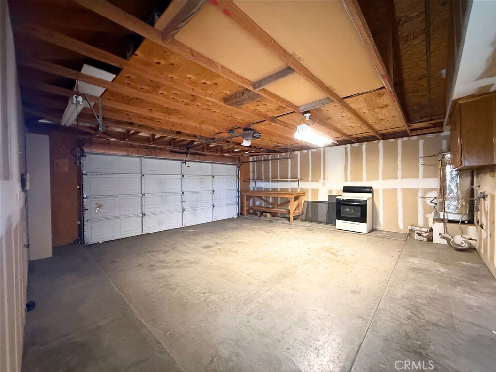 421 Petris Avenue Ridgecrest, CA 93555 - Photo 15 of 18 a view of a garage room with washing machine