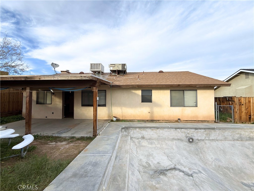 421 Petris Avenue Ridgecrest, CA 93555 - Photo 16 of 18 a front view of a house with a yard