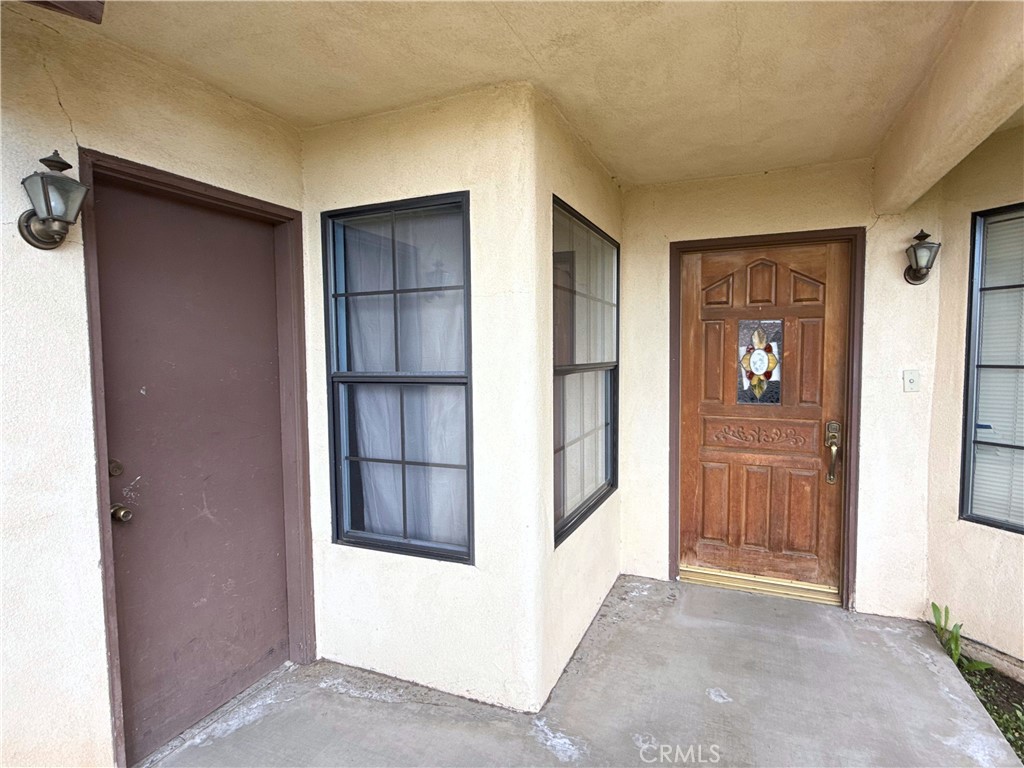 421 Petris Avenue Ridgecrest, CA 93555 - Photo 3 of 18 a view of a hallway with wooden shelves