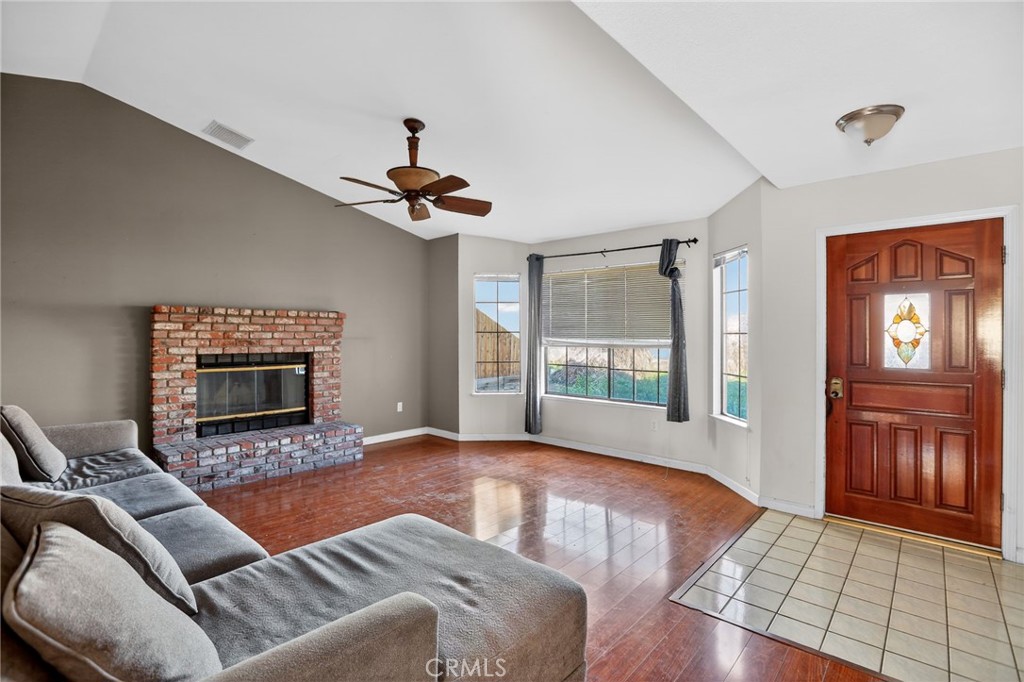 421 Petris Avenue Ridgecrest, CA 93555 - Photo 5 of 18 a living room with furniture and a fireplace