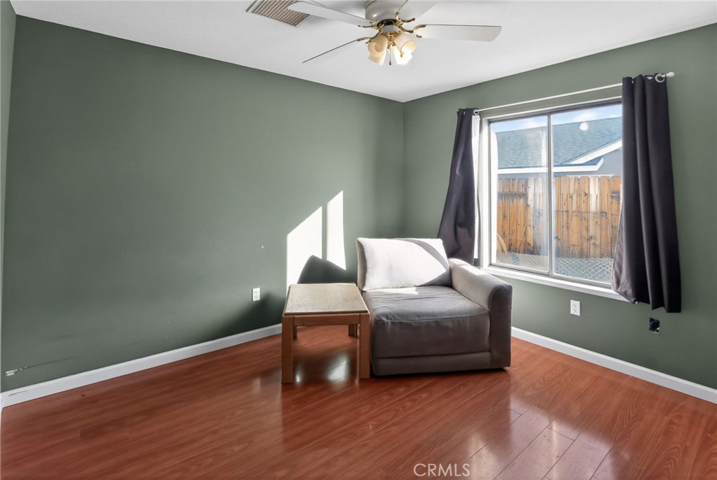 421 Petris Avenue Ridgecrest, CA 93555 - Photo 10 of 18 a living room with furniture and a window