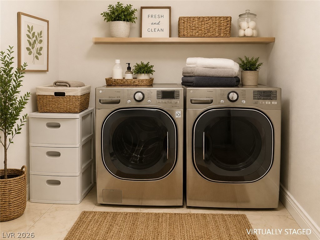 87 Tall Ruff Drive Las Vegas, NV 89148 - Photo 57 of 71 Streamlined laundry area with dual machines, offering practicality and neat organization.