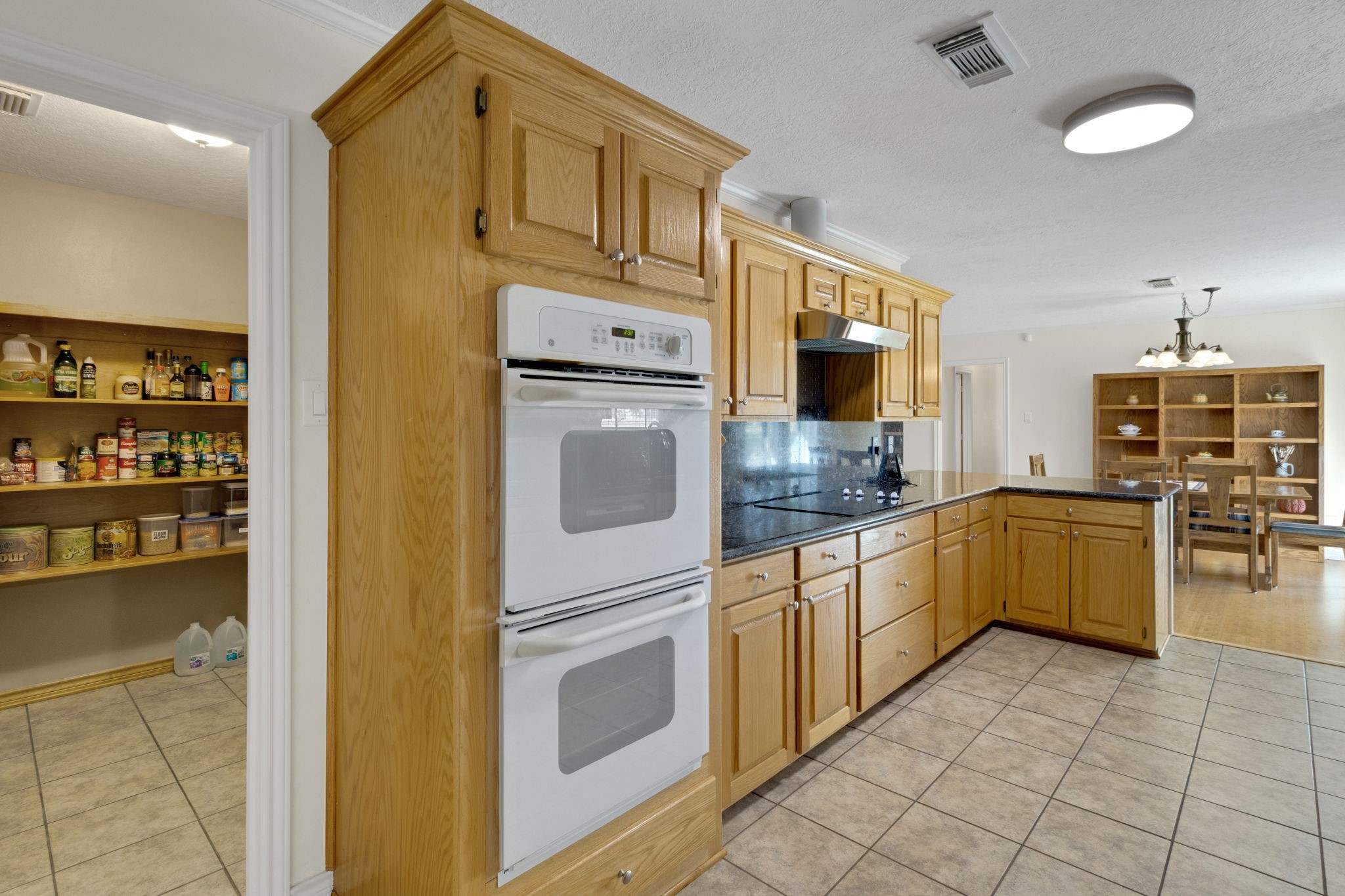 41 Holly Glen Point Blank, TX 77364 - Photo 15 of 35 a kitchen with stainless steel appliances granite countertop a refrigerator and a stove top oven
