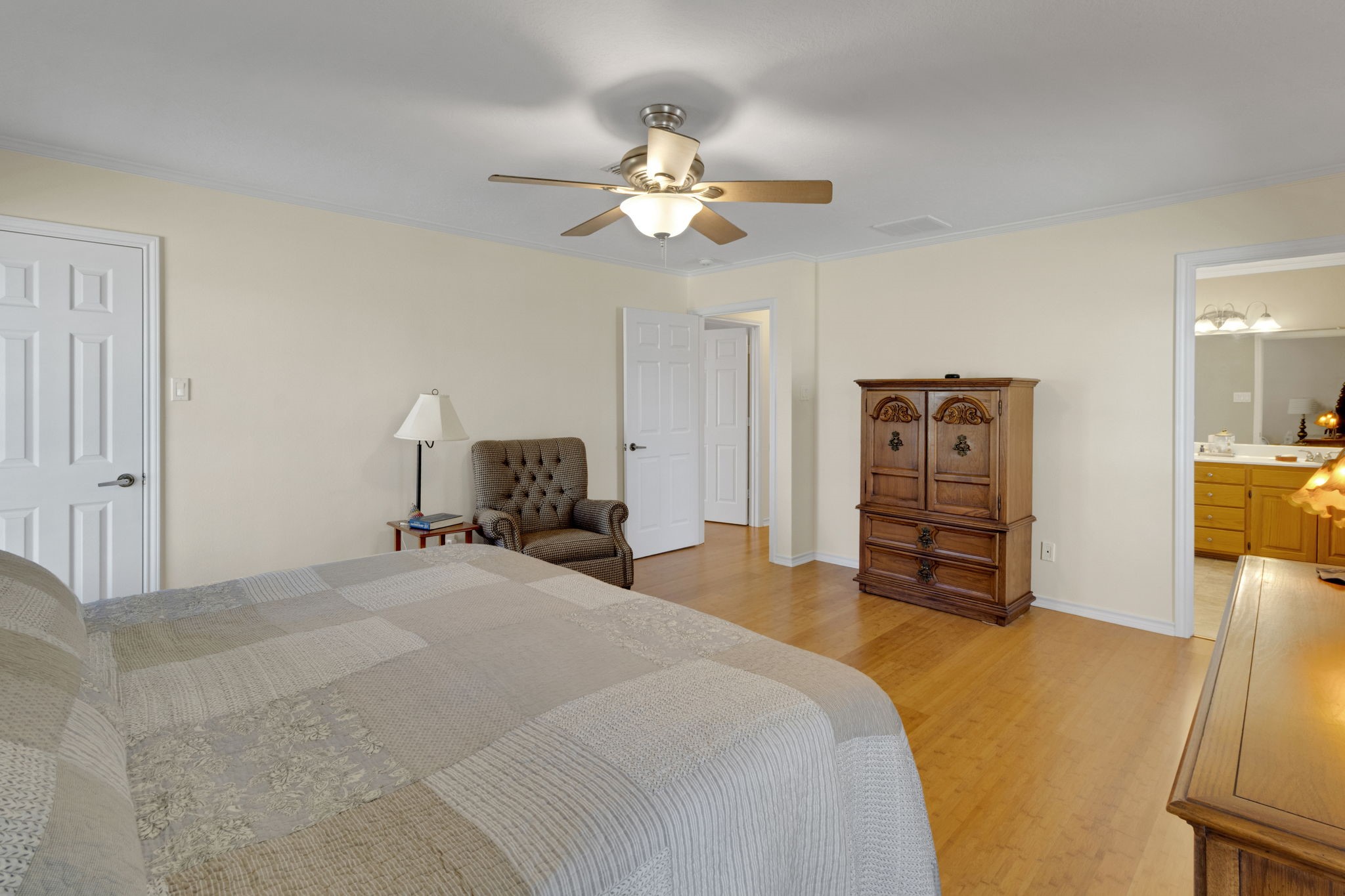 41 Holly Glen Point Blank, TX 77364 - Photo 18 of 35 a bedroom with a bed and a chandelier