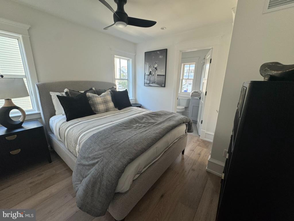 281 7th Street Avalon, NJ 08202 - Photo 11 of 62 a bedroom with a bed and a mirror